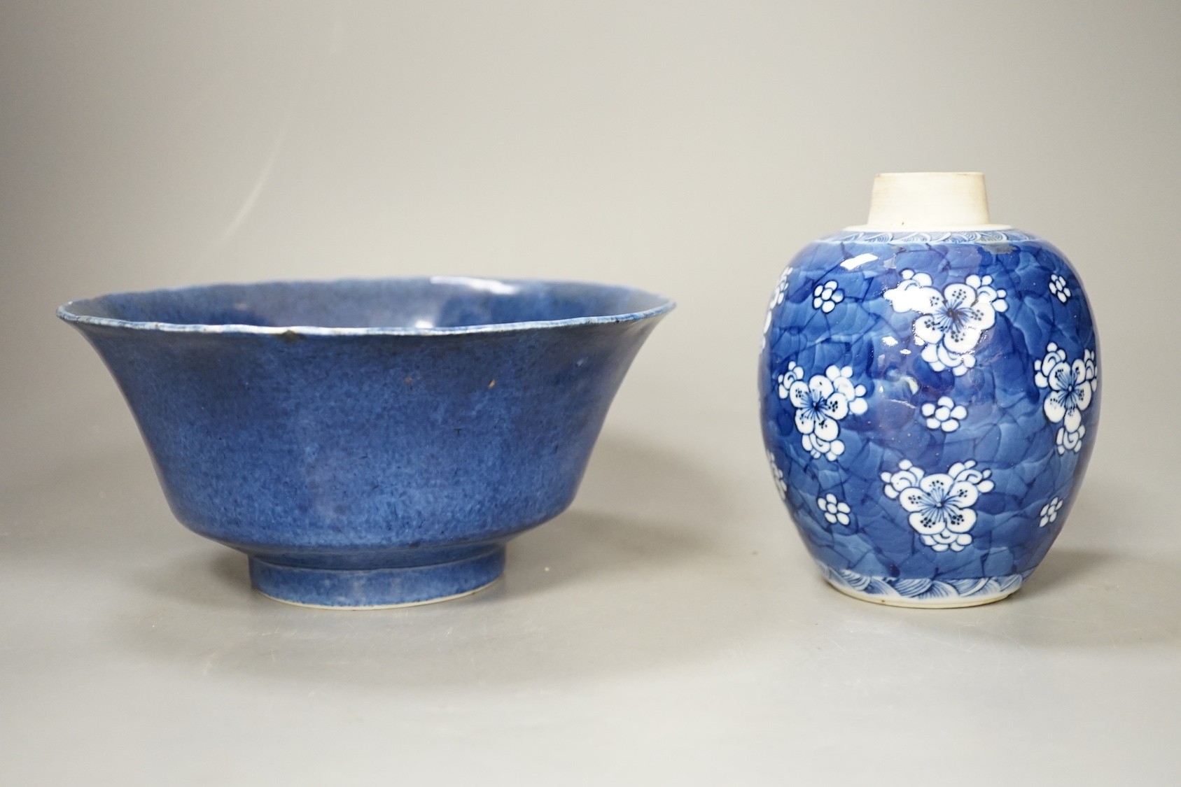 A Chinese powder blue bowl, early 18th century and a Chinese blue and white prunus jar - tallest 13cm